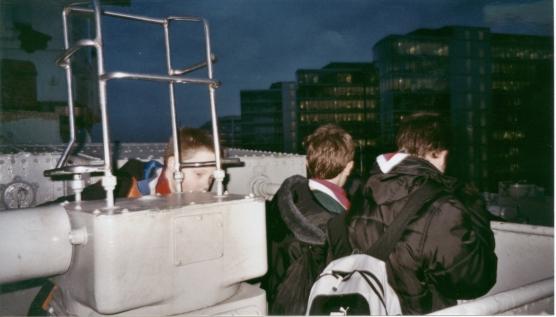 Cubs playing with a gun on HMS Belfast